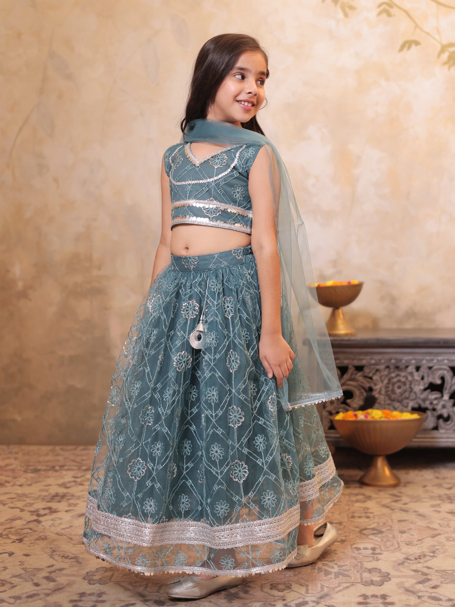 Girls Teal Net Sleeveless Heavy Embroidered Lehenga Choli