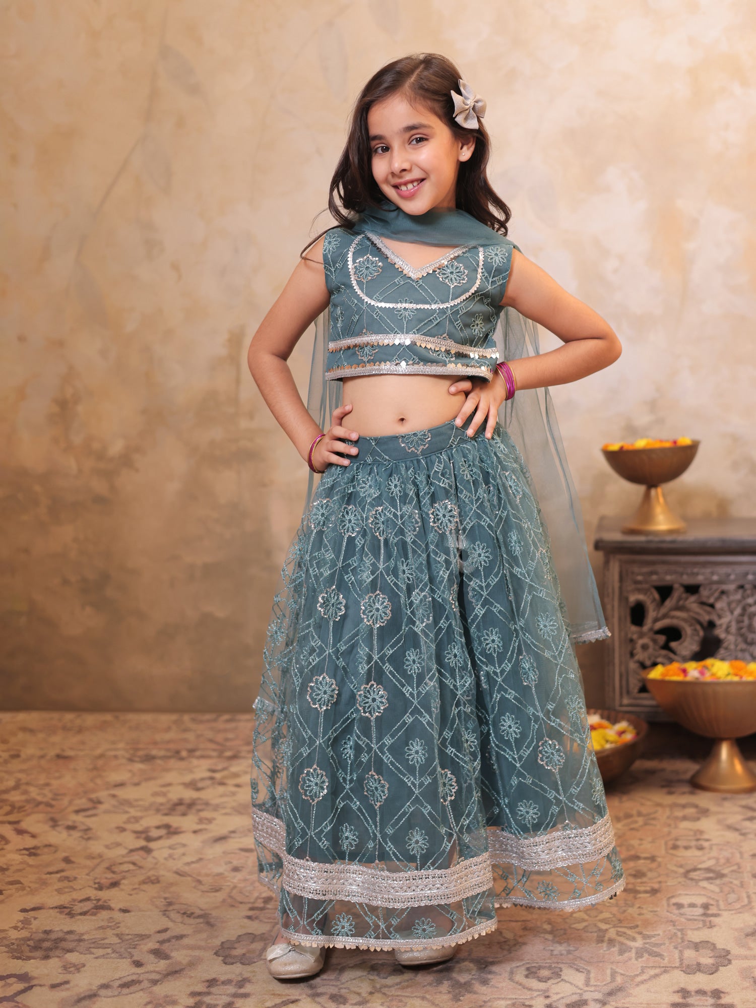 Girls Teal Net Sleeveless Heavy Embroidered Lehenga Choli